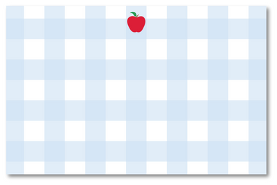 Notepad with blue and white checkered pattern and red apple on a white background