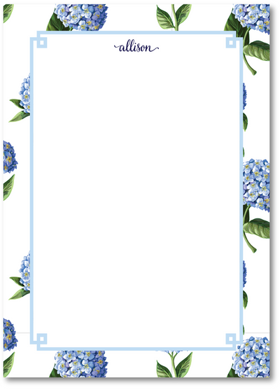 Floral border with blue flowers and green leaves on a white background