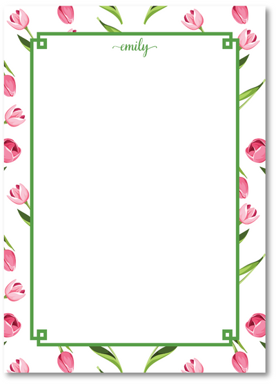 Floral border with pink tulips and green leaves on a white background