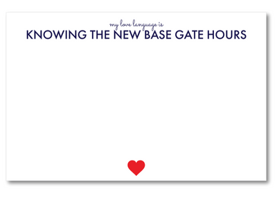 Note card with text 'my love language is KNOWING THE NEW BASE GATE HOURS' and a red heart on a white background