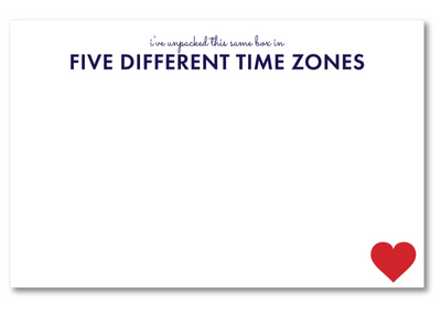 Note card with text 'I've unpacked this same box in FIVE DIFFERENT TIME ZONES' and a red heart on a white background.
