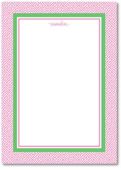 Notepad with pink geometric border and green frame on a white background