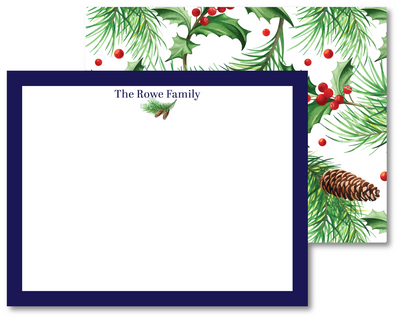 Christmas-themed stationery set with greenery and pinecones on a white background