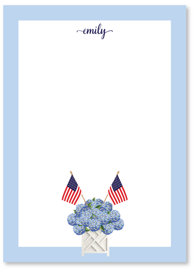 Personalized notepad with blue flowers and American flags on a light blue border, featuring the name 'Emily'.