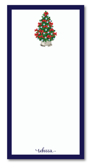 Notepad with a Christmas tree design and the name 'Rebecca' on a white background