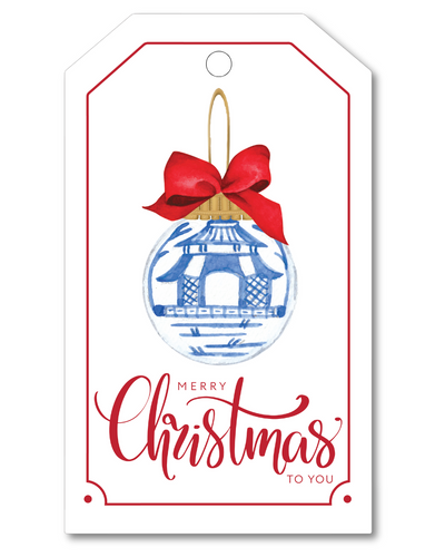 Christmas gift tag with blue ornament and red bow on a white background
