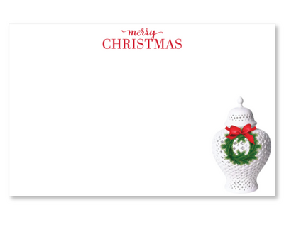 Christmas notepad with a white vase featuring a green wreath and red bow on a white background.