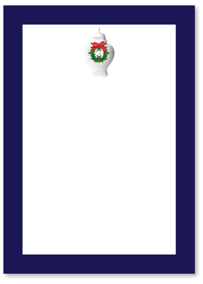Notepad with a Christmas-themed design on a white background