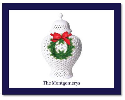 Decorative white vase with a red bow and green wreath on a white background, personalized with 'The Montgomerys'.