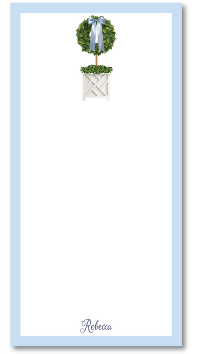 Notepad with decorative topiary design and name 'Rebecca' on a light blue border