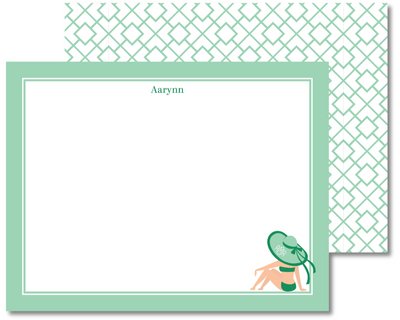 Note card with a design of a person in a swimsuit and hat, on a white background with green border.