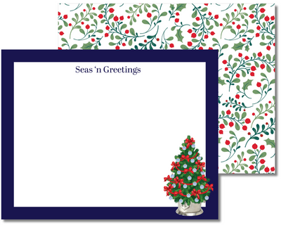 Christmas card with a decorated tree and 'Seas'n Greetings' text on a decorative border.