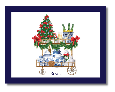 Decorative Christmas card with a cart, tree, and presents on a white background with a blue border.