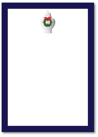 Notepad with a Christmas-themed design on a white background