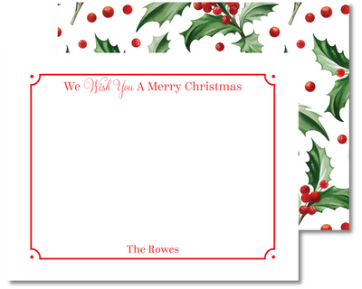 Christmas card with holly design and text 'We Wish You A Merry Christmas' on a white background.