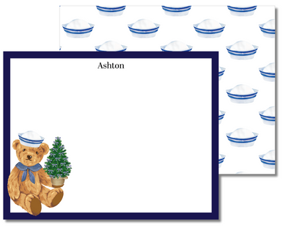 Note card with teddy bear design and patterned paper in the background