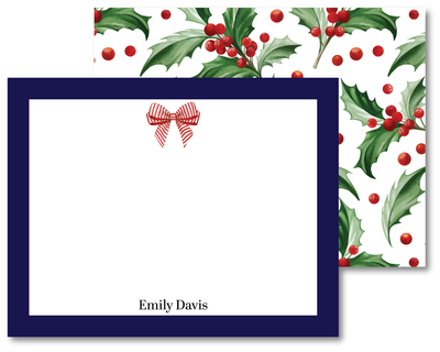 Christmas-themed stationery set with holly design and a bow on a white background