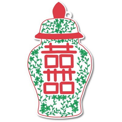 Decorative design with red Chinese characters and green leaves on a white background